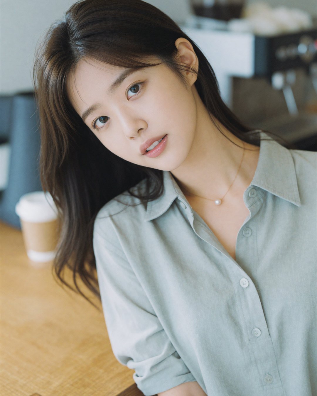 Another close-up of SEOA in a sage green shirt